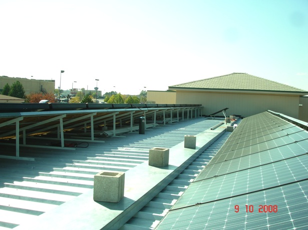 On roof behind collectors